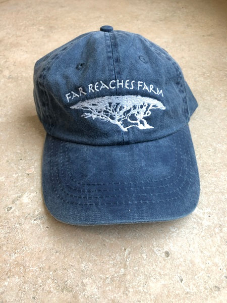A navy blue hat with the Far Reaches Farm logo